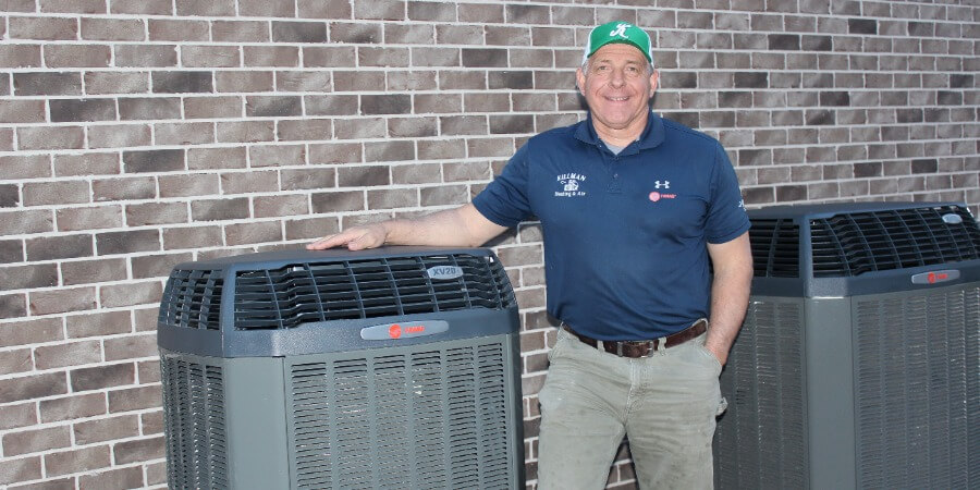 Killman Owner Standing Next To Trane Heat Pump (1)